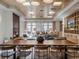 Well-appointed common area with a large dining table, fireplace, and multiple seating areas at 3701 Arapahoe Ave # 304, Boulder, CO 80303