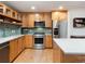 Well-lit kitchen features stainless appliances, light wood cabinets and a bright backsplash at 3701 Arapahoe Ave # 304, Boulder, CO 80303