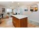 Large island separates living area from kitchen in this airy open floor plan at 3701 Arapahoe Ave # 304, Boulder, CO 80303