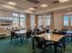 Bright meeting room with large windows offering mountain views and ample seating at 3701 Arapahoe Ave # 304, Boulder, CO 80303