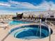 Stunning rooftop pool and hot tub area with lounge seating and vibrant murals at 3701 Arapahoe Ave # 304, Boulder, CO 80303