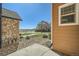 Backyard view of house and landscaping with rock groundcover at 5624 Killdeer St, Brighton, CO 80601