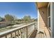 Balcony view of the neighborhood with a white railing and seating at 5624 Killdeer St, Brighton, CO 80601