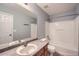 A full bathroom with a shower, toilet, and sink with a mirror at 5624 Killdeer St, Brighton, CO 80601