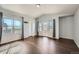 A bright primary bedroom with hardwood floors and large windows at 5624 Killdeer St, Brighton, CO 80601