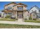 Charming two-story home with a welcoming front porch and manicured front lawn at 5624 Killdeer St, Brighton, CO 80601