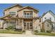 Inviting two-story home with a charming front porch and well-maintained landscaping at 5624 Killdeer St, Brighton, CO 80601
