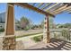View from the front porch of a home, showcasing stone columns and the neighborhood beyond at 5624 Killdeer St, Brighton, CO 80601