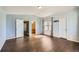 A bedroom with hardwood floors, light blue walls, and vaulted ceilings at 5624 Killdeer St, Brighton, CO 80601