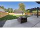 Large backyard with new fence, cement patio, fire pit, and built in outdoor kitchen with stainless steel grill at 2511 S Columbine St, Denver, CO 80210