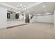 Spacious finished basement with bar area, decorative lighting, and neutral carpeting at 2511 S Columbine St, Denver, CO 80210