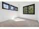Bright bedroom with plush carpeting and large windows providing ample natural light at 2511 S Columbine St, Denver, CO 80210