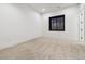 Minimalist bedroom showcases a neutral palette and bright, natural light at 2511 S Columbine St, Denver, CO 80210