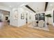 Open dining room with modern chandelier, neutral walls, and ample natural light at 2511 S Columbine St, Denver, CO 80210