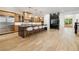 Spacious kitchen with island, breakfast bar seating, modern appliances, and wood cabinets at 2511 S Columbine St, Denver, CO 80210