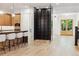 Spacious kitchen with an island, breakfast bar, and a floor to ceiling wine rack at 2511 S Columbine St, Denver, CO 80210