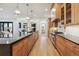 Well-appointed kitchen with stainless steel appliances, a center island, and custom cabinetry, offering both style and functionality at 2511 S Columbine St, Denver, CO 80210