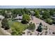 Aerial view of a property featuring a large, beautifully landscaped yard at 6633 E 166Th Pl, Brighton, CO 80602