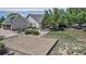 Expansive backyard featuring garden beds and a well-maintained lawn at 6633 E 166Th Pl, Brighton, CO 80602