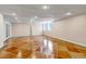 Open basement area with recessed lighting, windows, and unique patterned concrete flooring at 6633 E 166Th Pl, Brighton, CO 80602