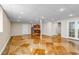 Spacious basement with unique flooring, a kitchenette, and access to additional rooms at 6633 E 166Th Pl, Brighton, CO 80602