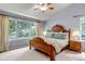 Comfortable bedroom featuring a large window overlooking the outdoors, complemented by soft lighting at 6633 E 166Th Pl, Brighton, CO 80602