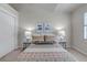Calm bedroom with soft lighting, featuring colorful accents and a large window at 6633 E 166Th Pl, Brighton, CO 80602