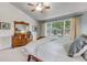 Light-filled bedroom with a view, featuring wood furniture and relaxing decor at 6633 E 166Th Pl, Brighton, CO 80602