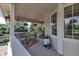 Relaxing covered patio area featuring a dining table and chairs, and pleasant outdoor views at 6633 E 166Th Pl, Brighton, CO 80602