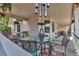 The outdoor living space features a dining table, chairs, and pleasant views at 6633 E 166Th Pl, Brighton, CO 80602