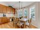 Bright dining area with hardwood floors, pendant lighting, and natural light from windows at 6633 E 166Th Pl, Brighton, CO 80602