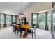 Bright dining room showcases a wood table, pendant lighting, and bay windows with curtains at 6633 E 166Th Pl, Brighton, CO 80602
