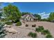 Well-maintained driveway with meticulous landscaping, leading to the home's garage at 6633 E 166Th Pl, Brighton, CO 80602
