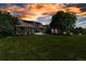 Exterior view of a home with a large front lawn and a welcoming front porch at 6633 E 166Th Pl, Brighton, CO 80602