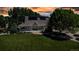 Aerial view of a home featuring a large front lawn and solar panels at 6633 E 166Th Pl, Brighton, CO 80602