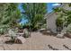 Cozy backyard patio with ample seating arrangements around a brick fire pit at 6633 E 166Th Pl, Brighton, CO 80602