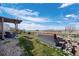 Enjoy the back patio and seating area with unobstructed views at 11671 Elkhart, Brighton, CO 80603