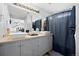 Bathroom featuring double sinks, stylish lighting, and modern fixtures; offering a clean and inviting space at 11671 Elkhart, Brighton, CO 80603