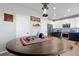 Cozy dining area with a unique lantern light fixture and a round wood table with storage at 11671 Elkhart, Brighton, CO 80603