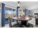 Inviting dining area with a round table, patio access, and views of the outdoor landscape at 11671 Elkhart, Brighton, CO 80603