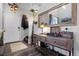 Welcoming entryway with rustic console table, large mirror, and convenient coat rack at 11671 Elkhart, Brighton, CO 80603