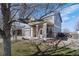 Charming two-story home with a welcoming front porch, a well-manicured lawn, and a two-car garage at 11671 Elkhart, Brighton, CO 80603