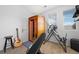 Home gym featuring a sauna, an inversion table, a weight bench, guitar, and plenty of natural light at 11671 Elkhart, Brighton, CO 80603
