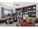 Spacious home office with custom built-ins and natural light is great for working from home at 11671 Elkhart, Brighton, CO 80603