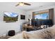 Dedicated home office featuring a large monitor setup and natural light for a productive workspace at 11671 Elkhart, Brighton, CO 80603