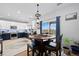 Bright eat-in kitchen features two-tone cabinets, stainless appliances, and access to the patio at 11671 Elkhart, Brighton, CO 80603