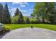 Expansive backyard with a stone patio and lush landscaping, ideal for outdoor relaxation and entertaining at 2222 E 7Th Avenue Pkwy, Denver, CO 80206