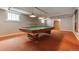 Finished basement with a pool table, fireplace, and natural light at 2222 E 7Th Avenue Pkwy, Denver, CO 80206