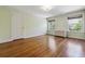 Bedroom with hardwood floors, closet space, natural light from two windows, and baseboard heaters at 2222 E 7Th Avenue Pkwy, Denver, CO 80206