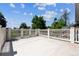 Open-air deck overlooking a yard with lush green trees and blue sky views at 2222 E 7Th Avenue Pkwy, Denver, CO 80206